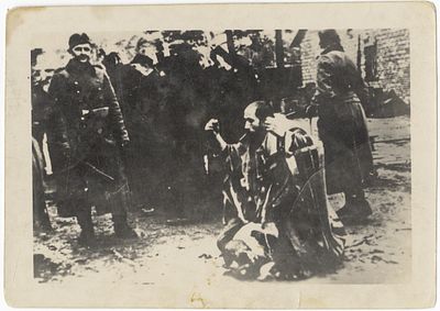 A photograph of the humiliation of Jews by Nazi soldiers. [Łuk&oacute;w], 1942. A photograph of the 