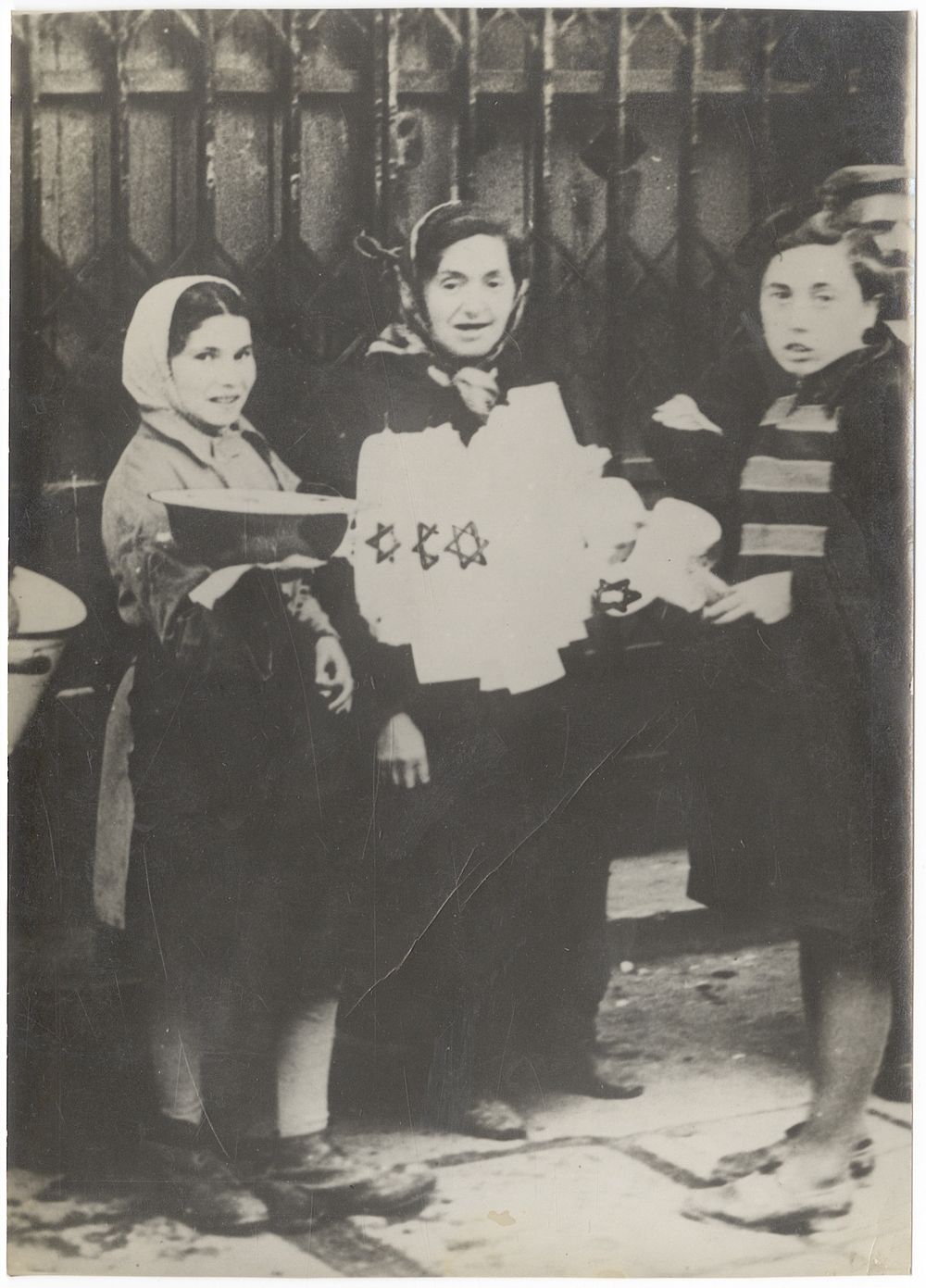 Jewish women selling armbands in the Warsaw Ghetto. Photograph of Jewish women selling armbands 