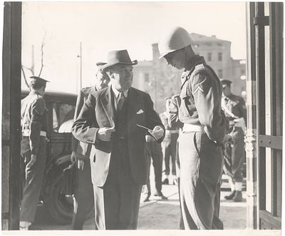 "The Man Who Would Read the Verdict" - Lord Justice Lawrence Undergoing a Security Check Before 