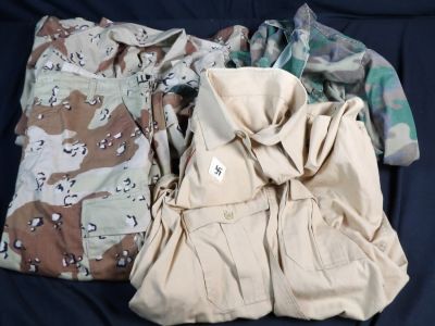 Lot of original Hollywood military costumes. Marked Stembridge Gun Rentals Studios on interiors