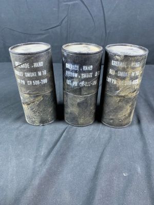 Lot of original M18 Smoke Grenade Canisters. You get violet, yellow and red. Used condition. 