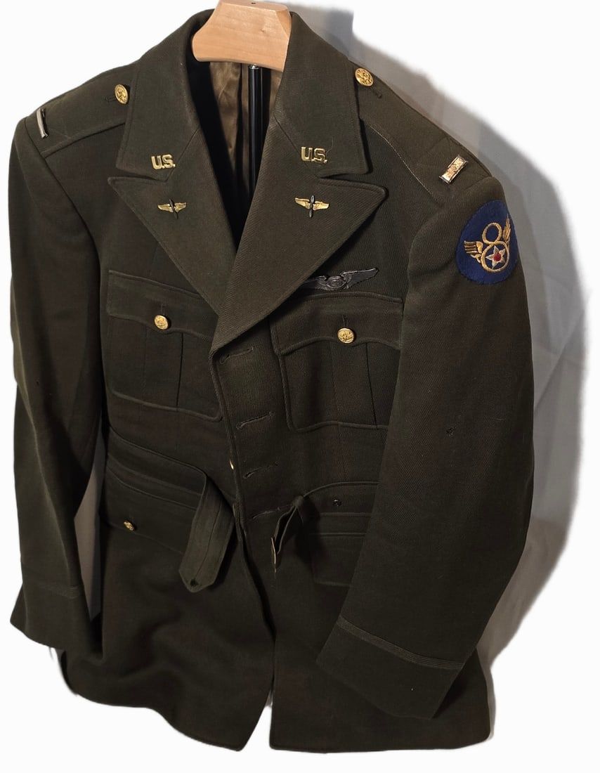 Lot 135: Beautiful and rare WWII Stubby 8th Navigator, named officer jacket