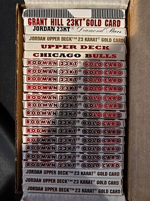 A Collection of 23KT Gold-Layered Basketball Trading Card Boxes Including Michael Jordan and Dennis