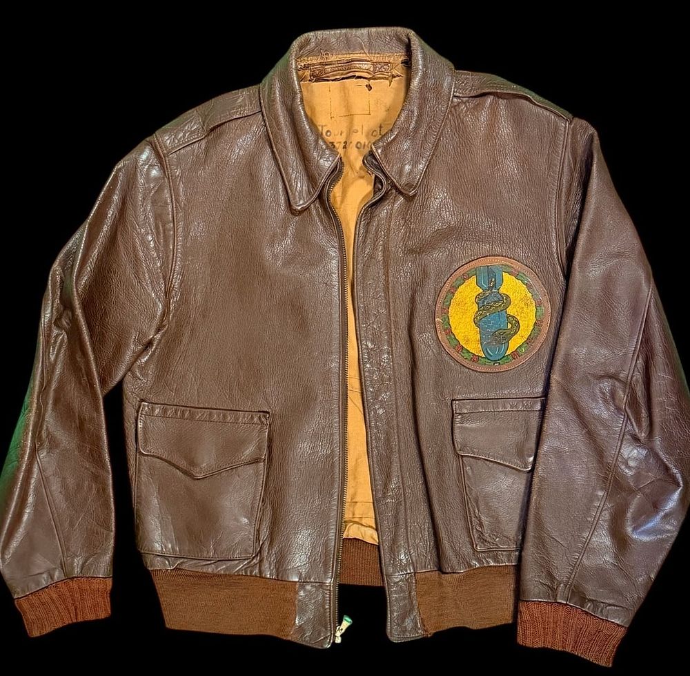 Lot 329: WWII A-2 Jacket with 490th Bomb Squadron Patch. Named