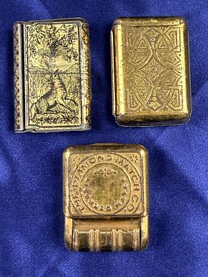 A Trio of Vintage Metal Matchbox Holders and Vesta Cases Including The Diamond Match Co. This 