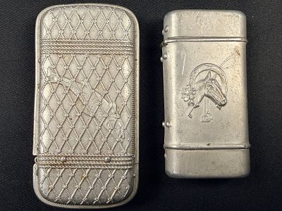 Two Antique White Metal Vesta Cases Featuring Equestrian and Trompe l'Oeil Motifs. This lot 