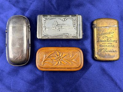 A Group of Four Antique Vesta Cases including Patent, Souvenir, Advertising, and Carved Wood. A 