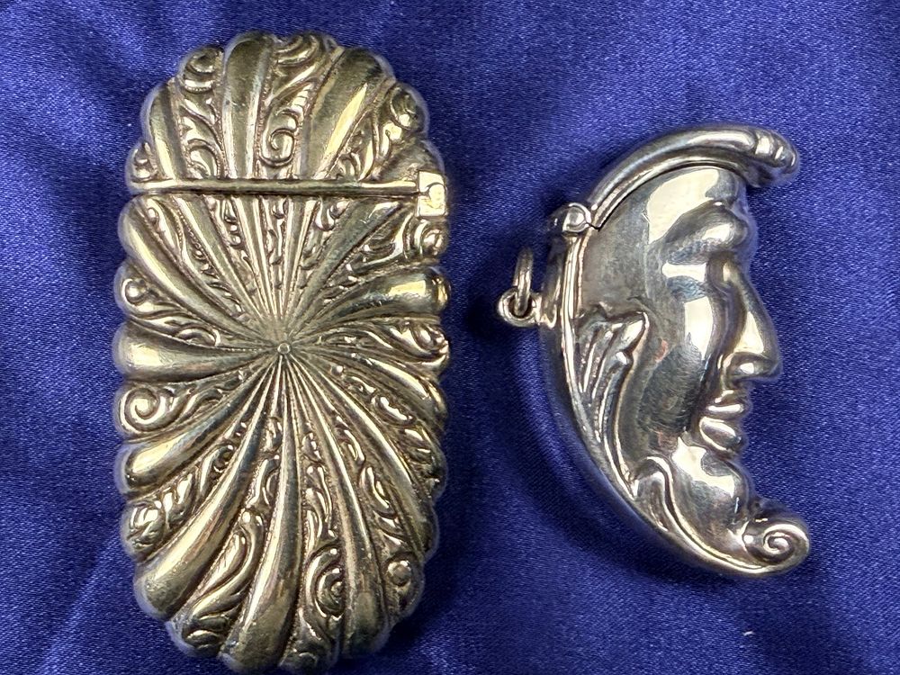 Lot 59: Two Victorian Style Silver-Toned Metal Pocket Accessories Including a Vesta Case and Man in the Moon