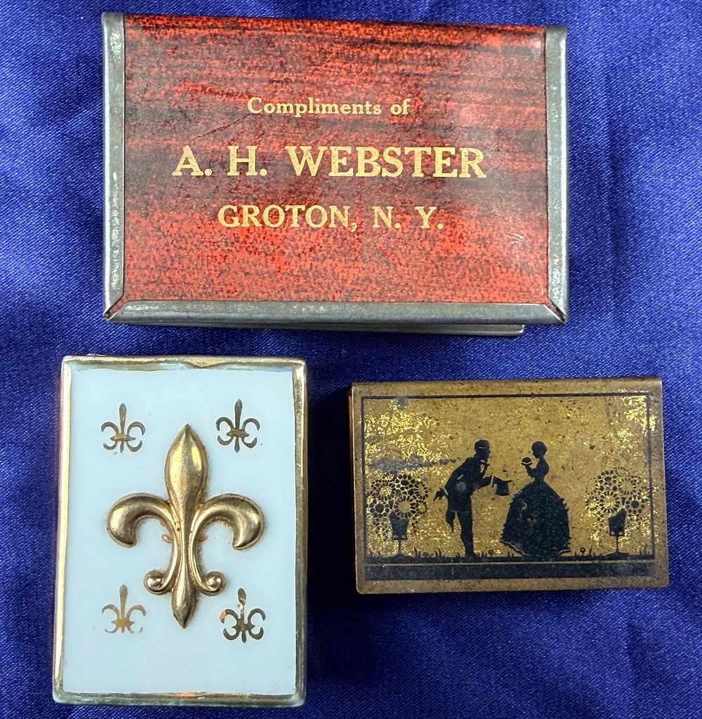Lot 71: A Trio of Vintage Metal Advertising and Decorative Matchbook Covers and Matchbox Sleeve