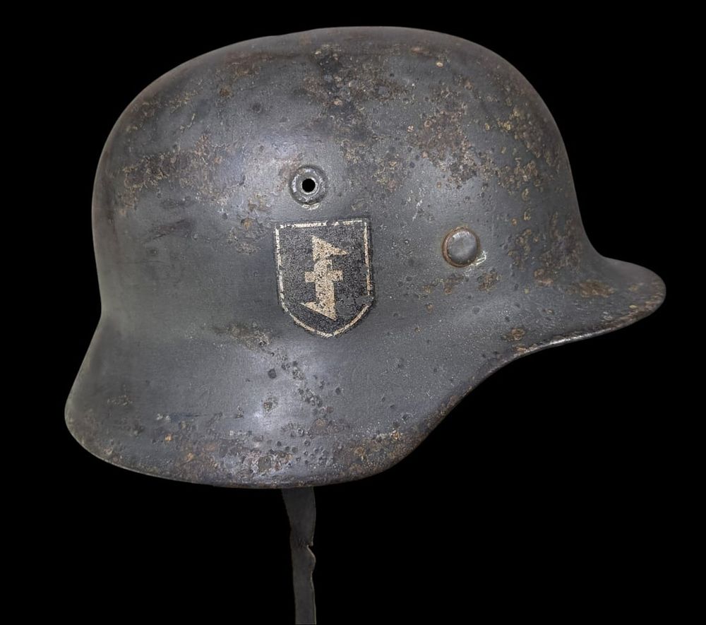 Lot 463: WWII German M40 Stahlhelm with Wolfsangel Shield