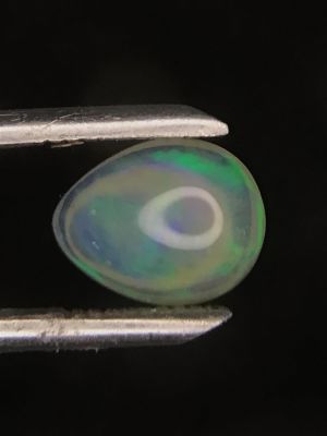 Opal gemstone. Cabochon cut Opal from Ethiopia. 1.35 carats total.