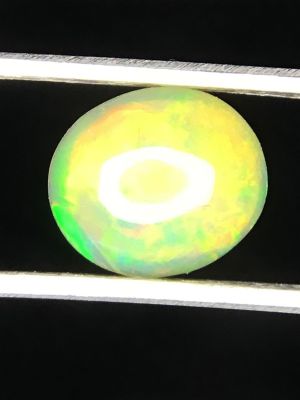 Opal gemstone. Cabochon cut Opal gemstone from Ethiopia. 1.05 carats.