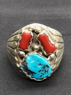 Navajo handmade ring. Sterling silver Navajo handmade ring featuring turquoise and red coral 