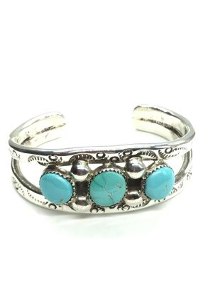 Zuni handmade bracelet cuff. Sterling silver handmade Zuni cuff featuring turquoise stones. 
