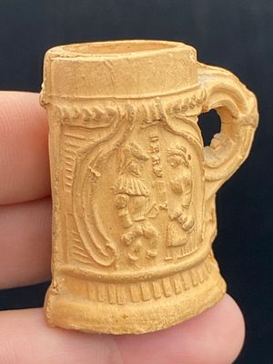 Artifact, Rock, History, Collectible, Tool,. Artifact: Beer Stein Mark Figurine 1910s