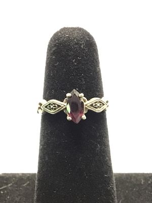 Sterling silver ring. Sterling ring with red garnet gemstone. 2.47 grams total weight. Size 6 1/2.