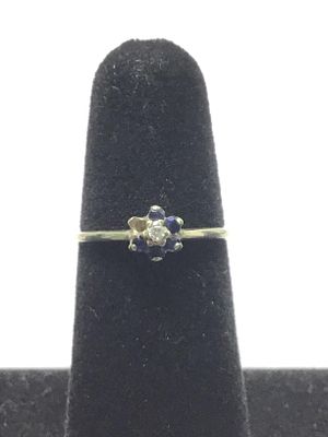 10k gold ring. 10k white gold ring with diamond and sapphire gemstones. Missing one sapphire. 