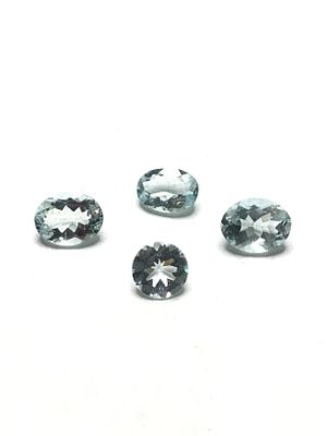Aquamarine gemstones. 1 round and 3 oval cut aquamarines. 5.55 carats total weight.