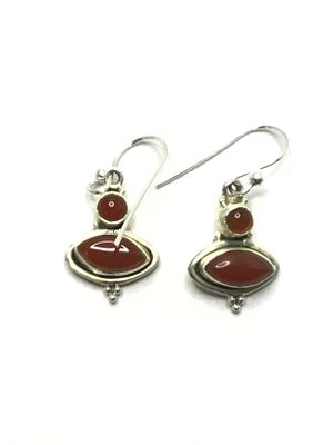 Sterling silver earrings. Sterling earrings with red garnet gemstones. 4.27 grams total weight.