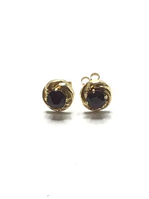 14k gold earrings. 14k yellow gold stud earrings with red gemstones. 0.52 grams total weight.