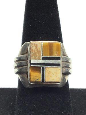 Artisan made ring. Sterling silver ring featuring multiple stone inlay. 15.62 grams of total 