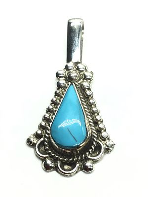 Zuni handmade pendant. Sterling silver pendant featuring turquoise stone. 7.62 grams of total 