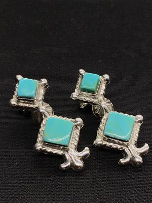 Navajo handmade earrings. Sterling silver earrings featuring Kingman turquoise stones. 8.47 