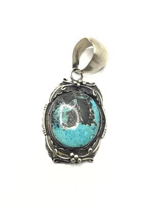 Navajo handmade pendant. Large sterling silver pendant with turquoise stone. 23.18 grams total 