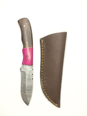Damascus skinning knife with sheath. 4 inch blade length.