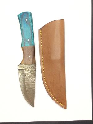Damascus skinning knife with sheath. 3 3/4 inch blade length.
