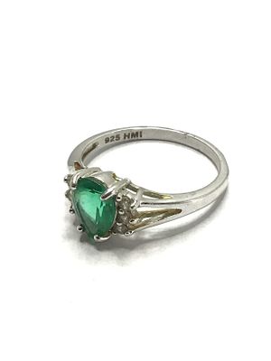 Sterling silver ring. Sterling ring with clear green center gemstone. 3.63 grams total weight. 