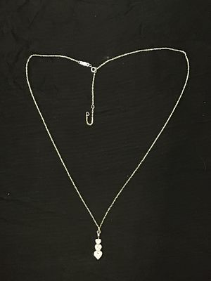 14k gold necklace with pendant. 14k white gold necklace with pendant featuring CZ heart 