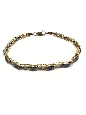 10k gold bracelet. 10K yellow and white gold bracelet featuring blue sapphire and diamond 