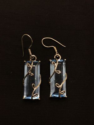 Sterling silver earrings. Sterling earrings with clear blue gemstones. 9.25 grams total weight.