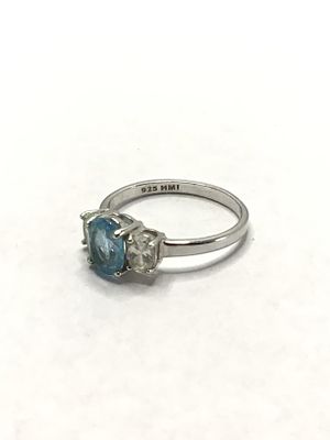 Sterling silver ring. Sterling ring with blue topaz center stone. 4.01 grams total weight. Size 