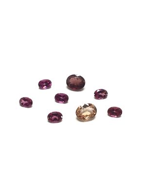 Pink tourmaline gemstones. Oval cut pink tourmalines. Various shades. 10.85 carats total.