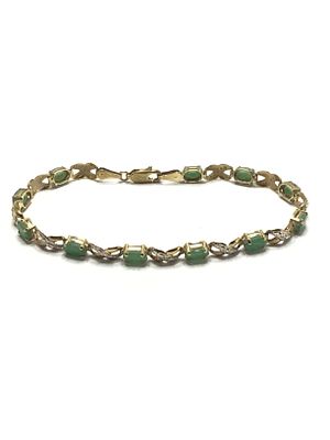 10k gold bracelet. 10K yellow and white gold bracelet featuring emerald gemstones. 5.37 grams of 