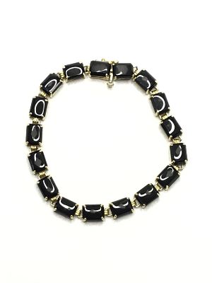 14k gold bracelet. 14k yellow gold bracelet with onyx stones. 10.70 grams total weight. 7 inches 