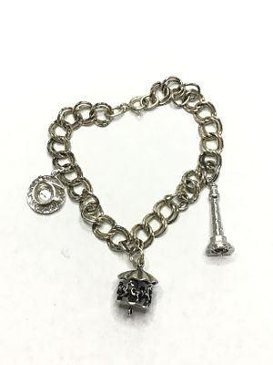 Sterling silver bracelet. Sterling bracelet with charms. 17.93 grams total weight. 7.5 inches length.