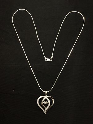 Sterling silver necklace with pendant. Sterling necklace with heart shaped pendant featuring CZ 