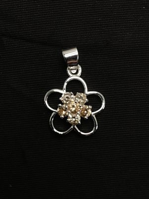 Sterling silver pendant. Sterling pendant with yellow gemstones. 1.61 grams total weight.