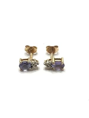 10k gold earrings. 10K white gold earrings featuring tanzanite gemstone. 1.13 grams of total weight.