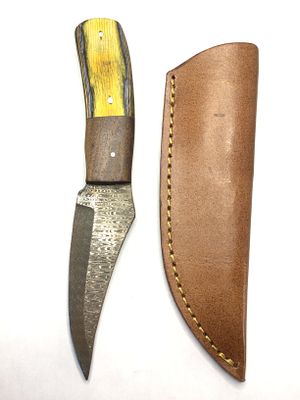 Damascus skinning knife with sheath. Full tang. 4 inch blade length.