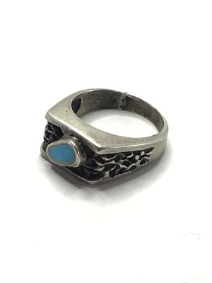 Artisan handmade ring. Sterling silver ring with turquoise stone. 6.71 grams total weight. Size 7.
