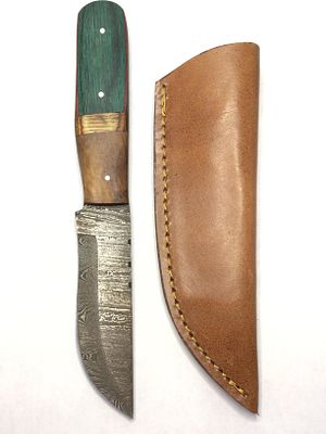 Damascus skinning knife with sheath. 4 inch blade length.