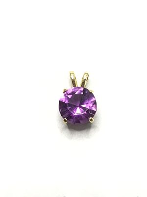 14k gold pendant. 14k yellow gold pendant with amethyst gemstone. 1.40 grams total weight.