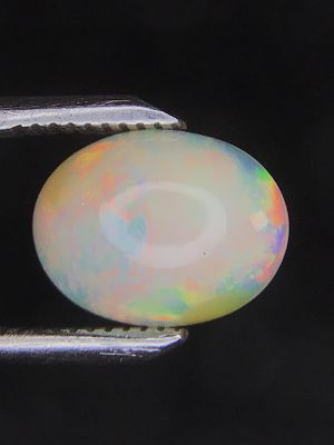 Opal cabachon. 12x9mm Opal cabachon from Ethiopia. 2.65 carats total.