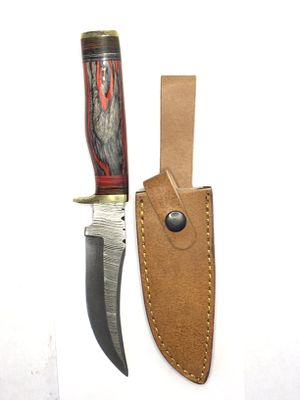 Damascus skinning knife with sheath. 5 1/4 inch blade length.