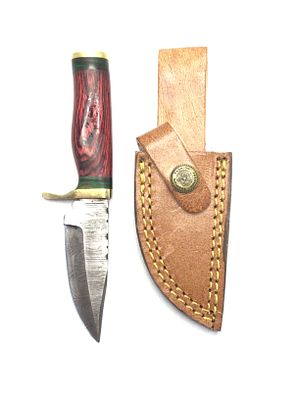 Damascus skinning knife with sheath. 3 inch blade length.