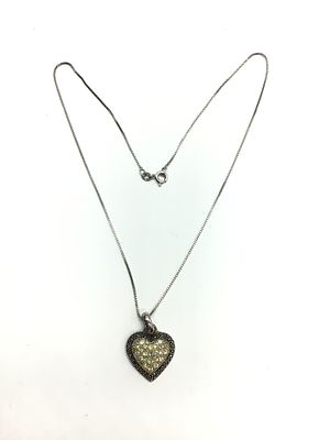 Sterling silver necklace with pendant. Sterling necklace with pendant featuring clear gemstones. 